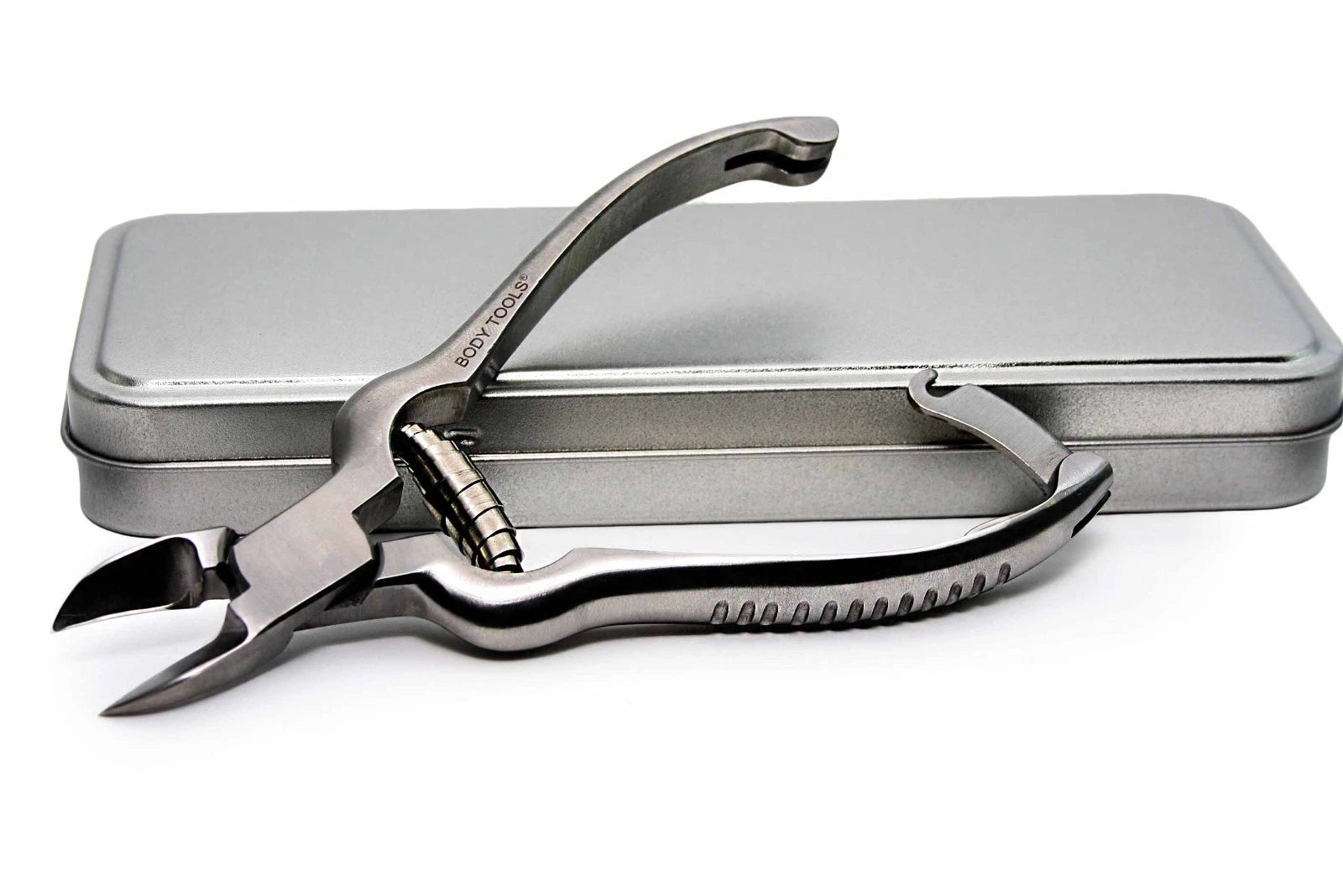 Metal pliers with a metallic case on a white background